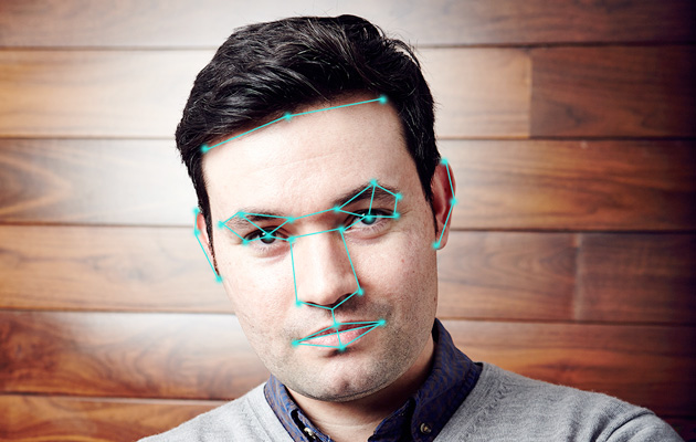 A young man's face with facial recognition lines superimposed