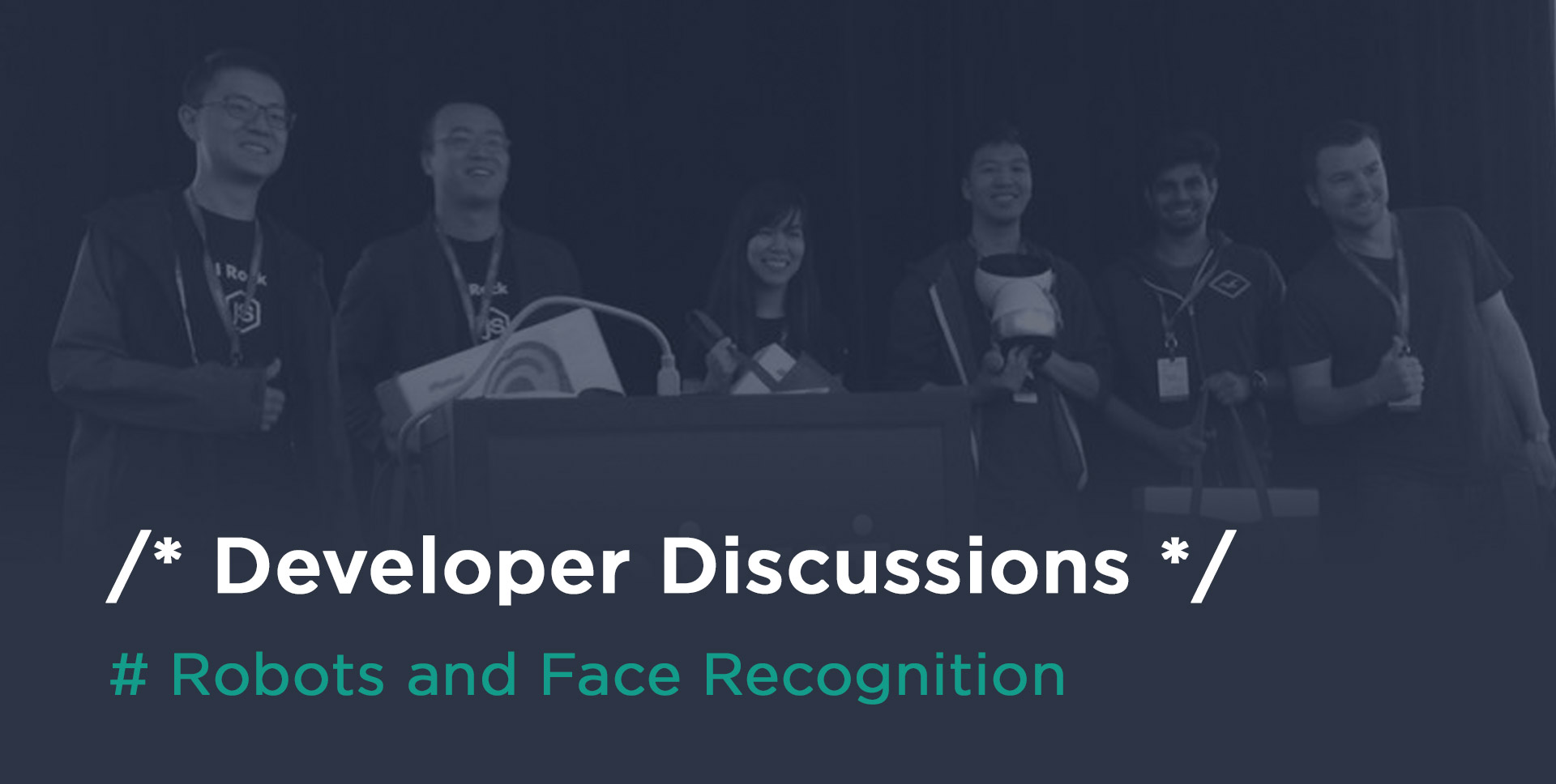 Photo of a team of developers on stage at a hackathon about robots and face recognition